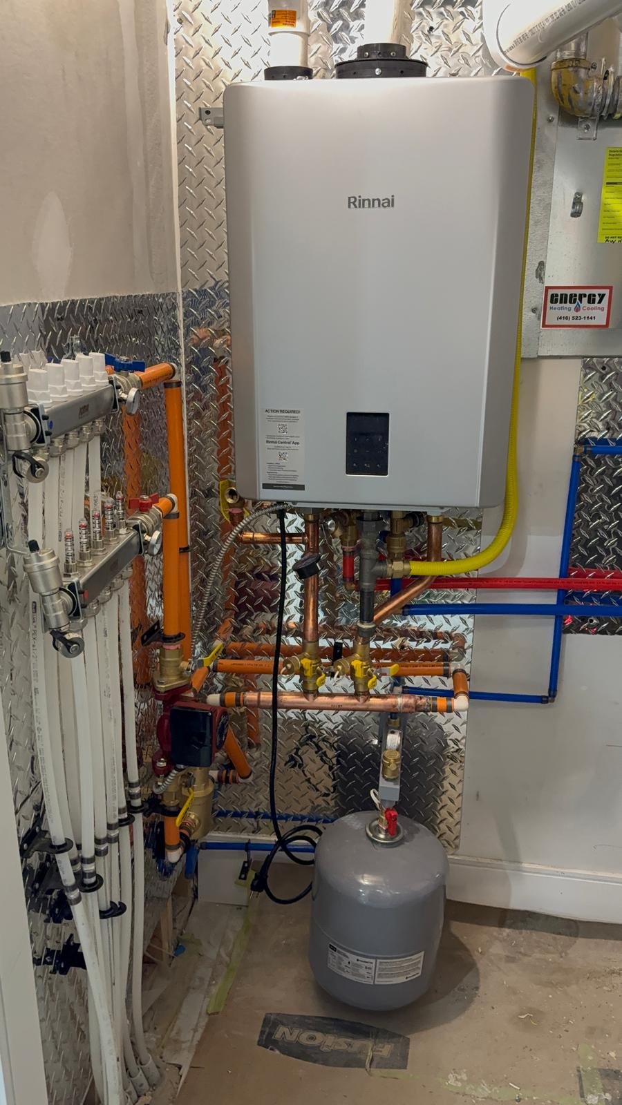 Rinnai combi boiler installation with manifold and expansion tank basement GTA