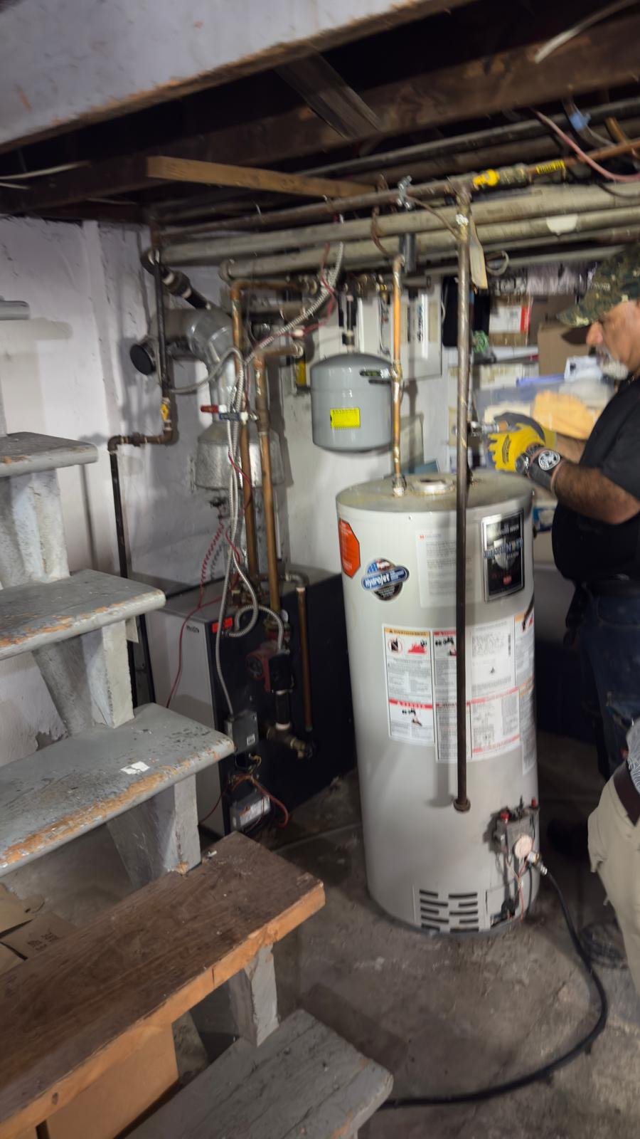 HVAC Smart Solution technician installing boiler and water heater basement Toronto