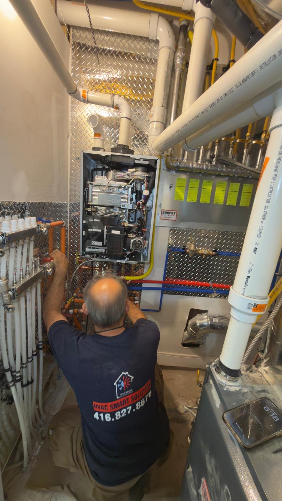 HVAC Smart Solution technician installing Rinnai combi boiler GTA