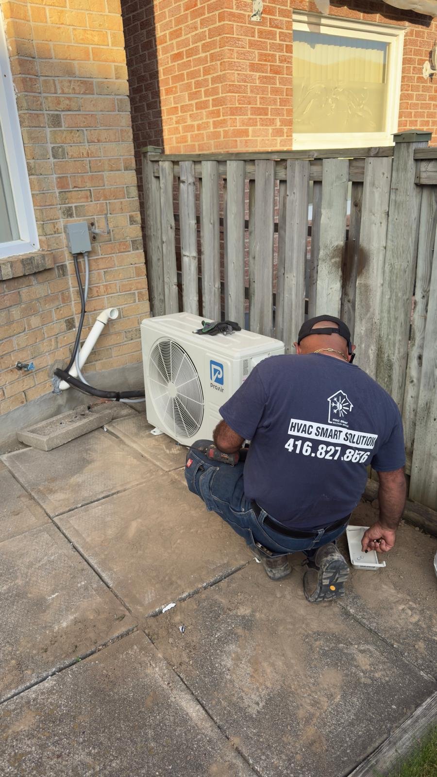 Two ton side discharge air conditioner condenser installation exterior GTA